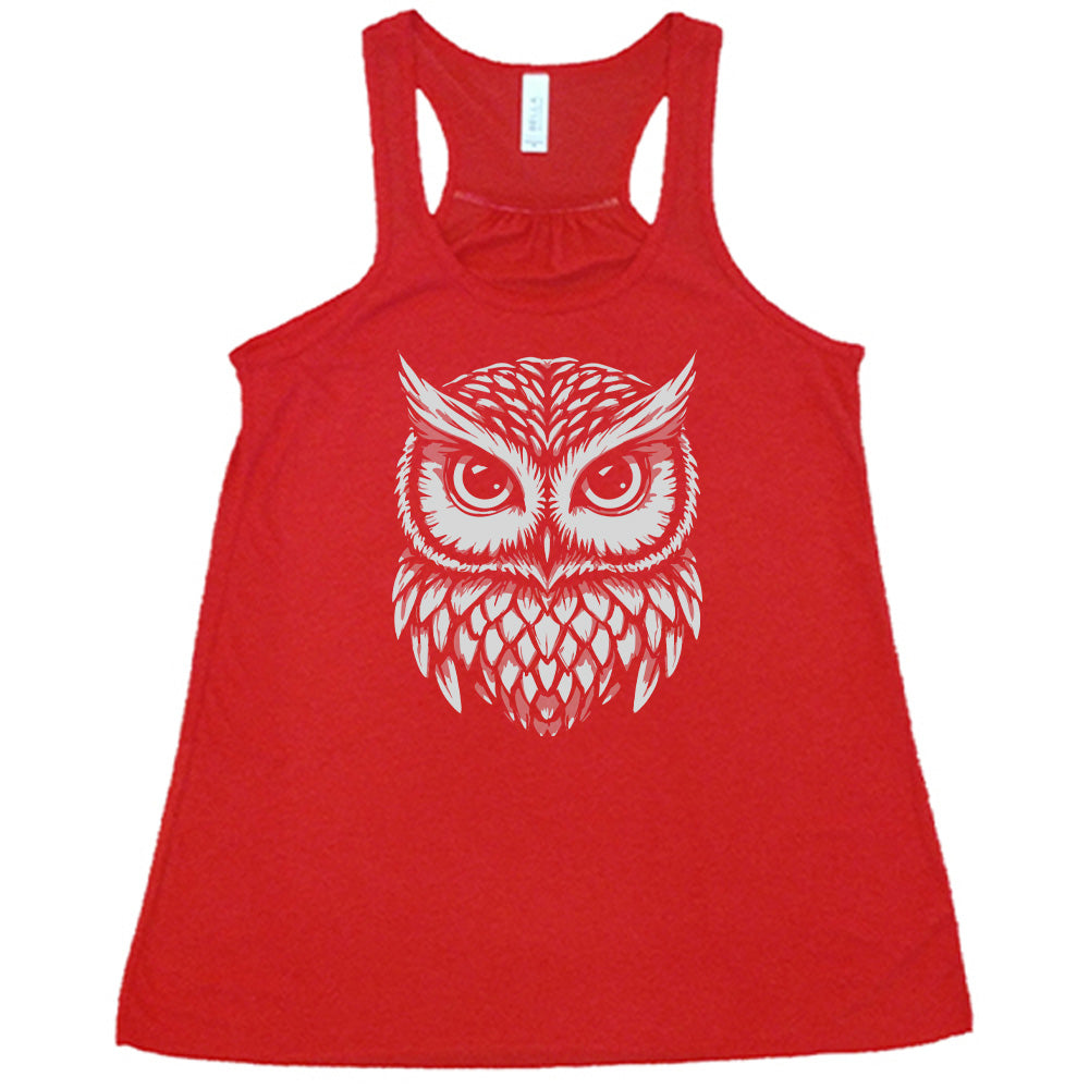 Red colored flowy tank with stylized owl graphic on it