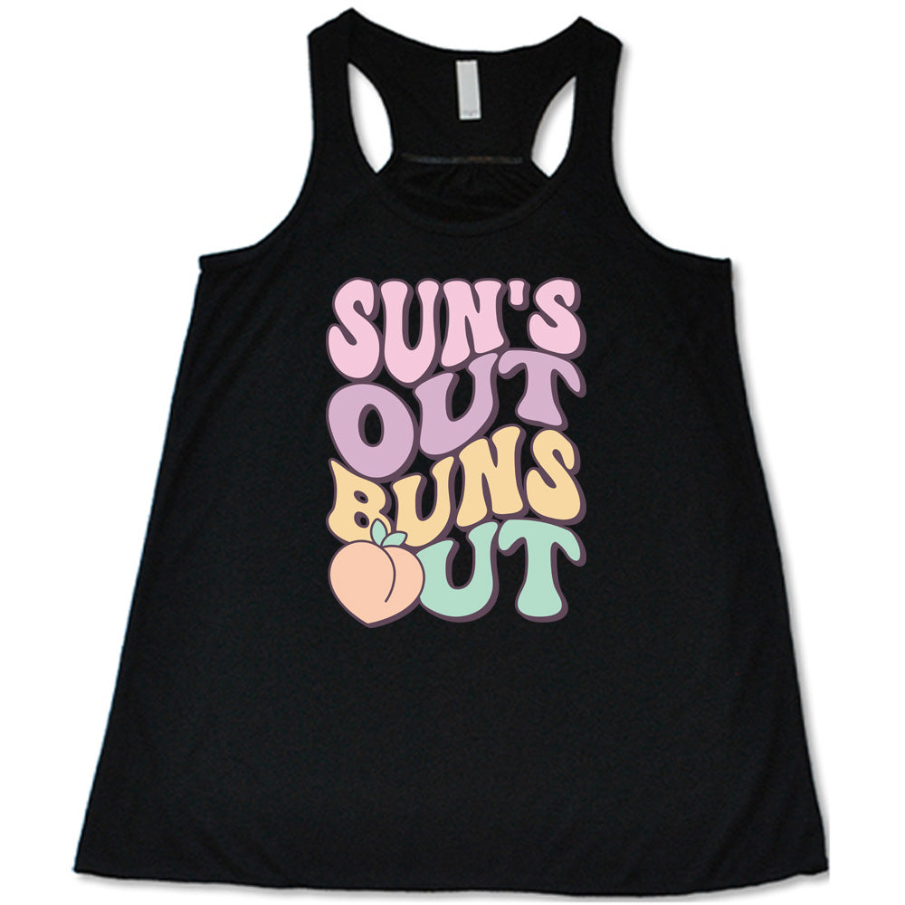 Black colored flowy tank with a peach graphic on it that says "Suns Out Buns Out"