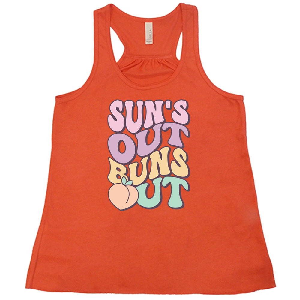 Coral colored flowy tank with a peach graphic on it that says "Suns Out Buns Out"