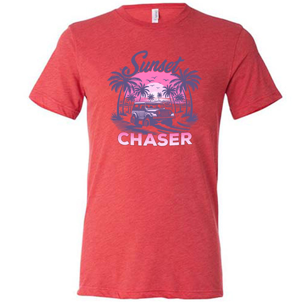 Red colored shirt with a vehicle on the beach graphic on it that says "Sunset Chaser"