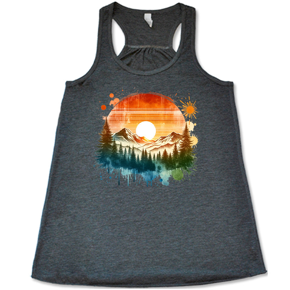 Grey colored flowy tank with a sunset-mountain landscape graphic on it
