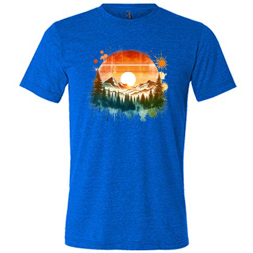 Blue colored shirt with a sunset-mountain landscape graphic on it