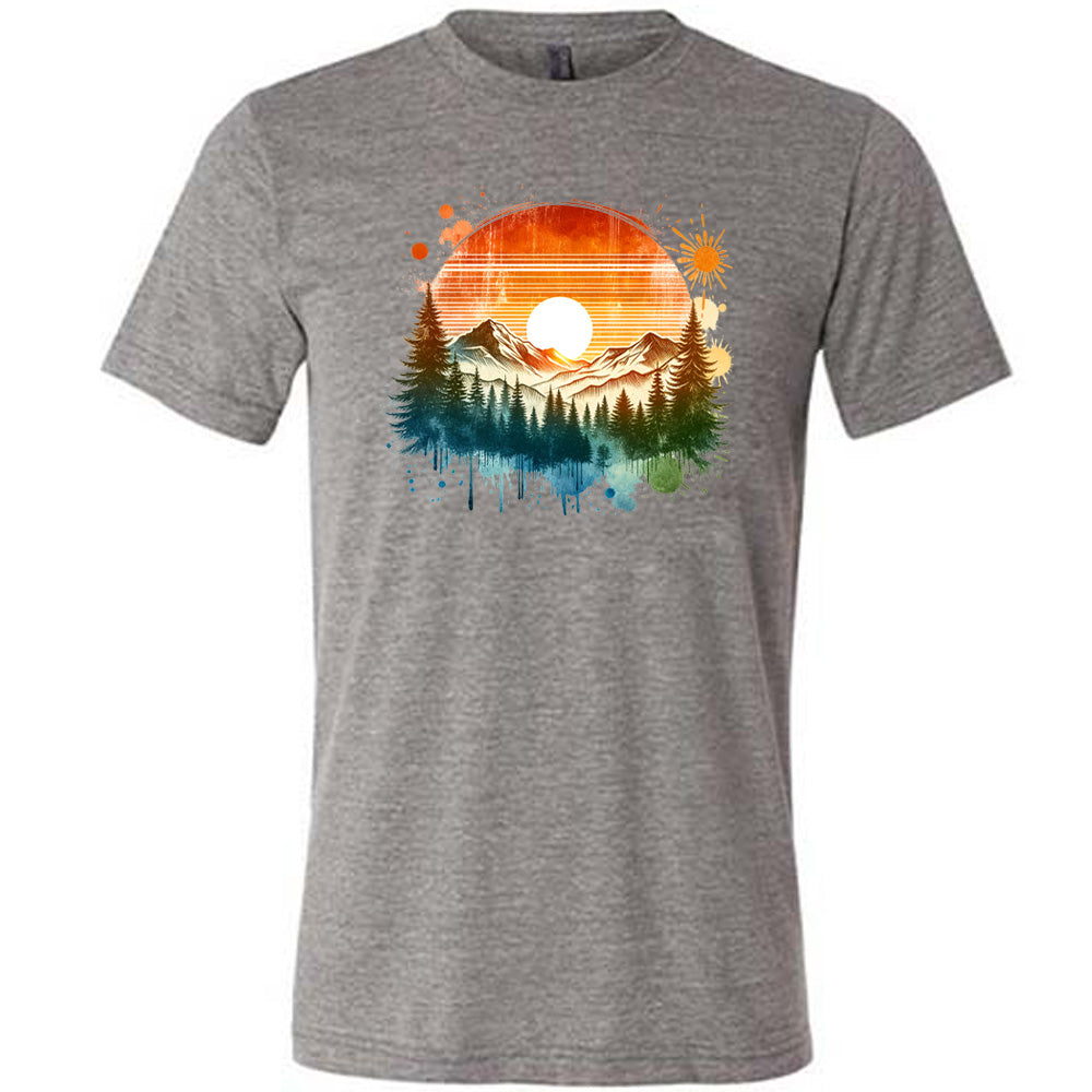 Grey colored shirt with a sunset-mountain landscape graphic on it