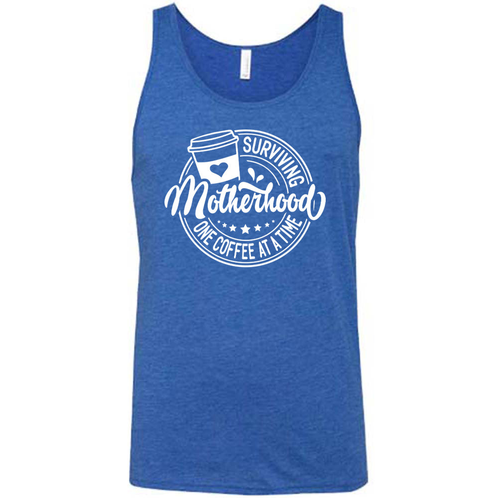 Blue colored tank with a coffee cup graphic on it that says "Surviving Motherhood One Coffee at a Time"