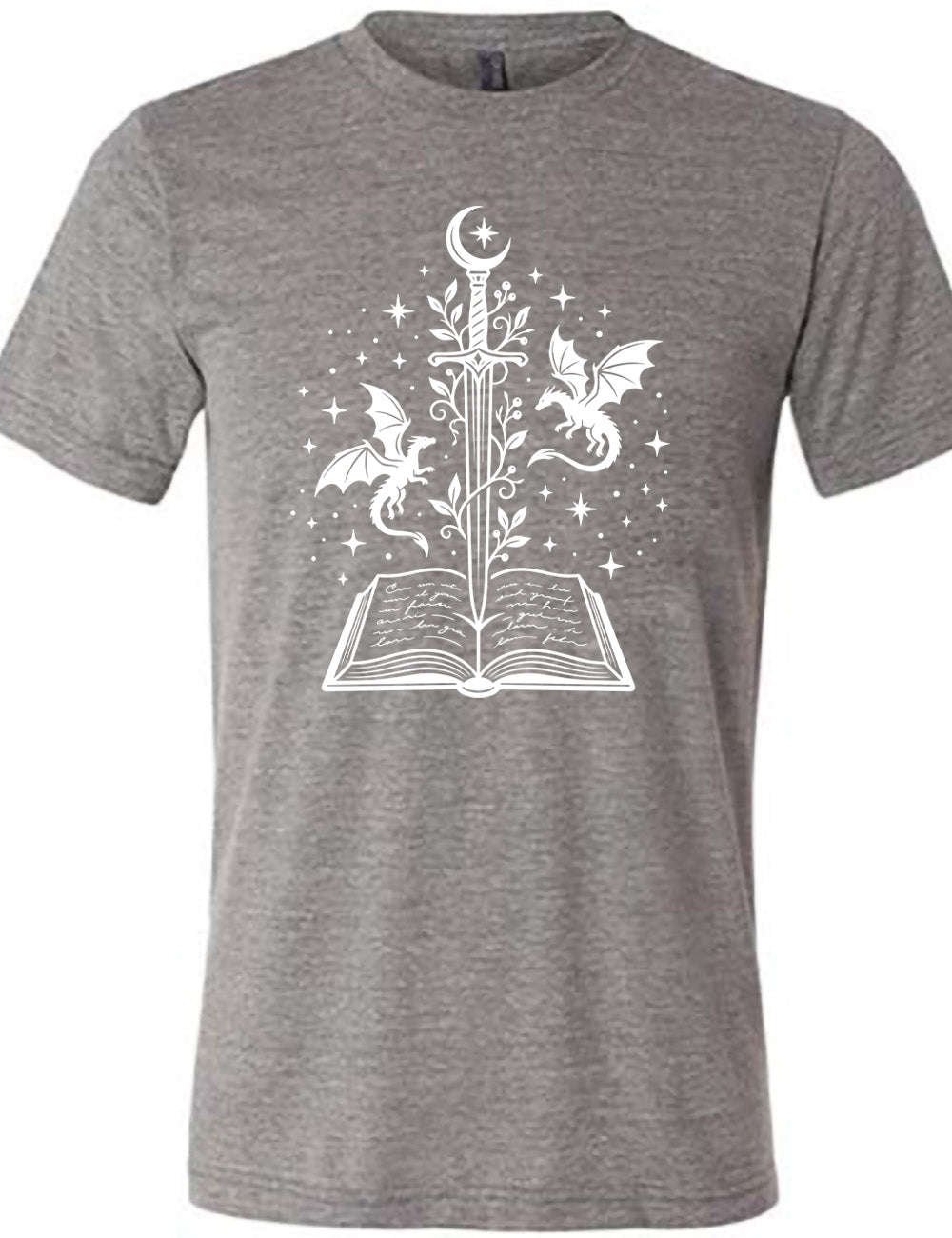 grey unisex tee with the graphic of a sword, with a crescent moon on top of the handle and with a vine wrapping around it, pointing down into an open book, surrounded by stars, and a dragon flying on either side