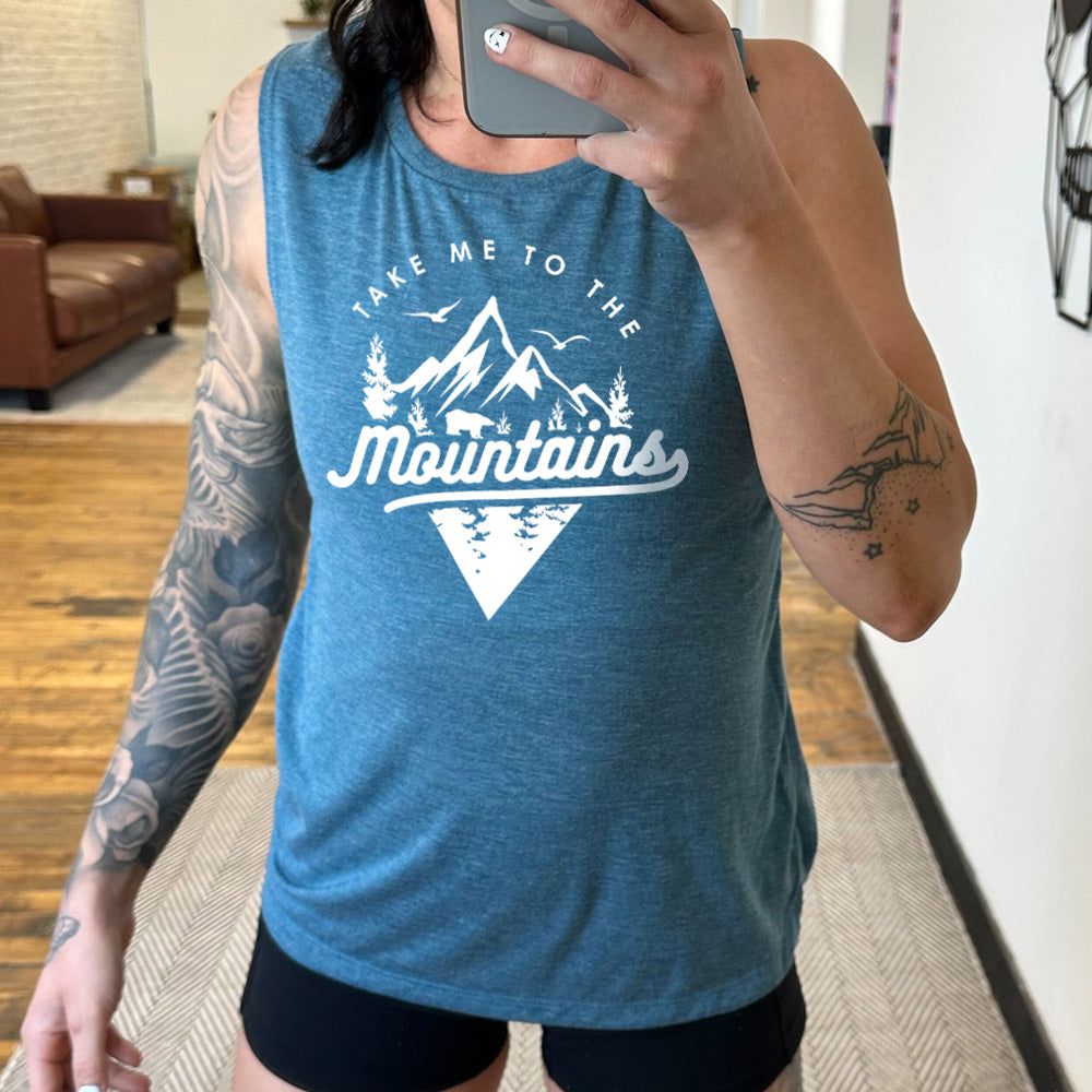 deep teal muscle tank with a mountains graphic on it that says "Take Me To The Mountains"