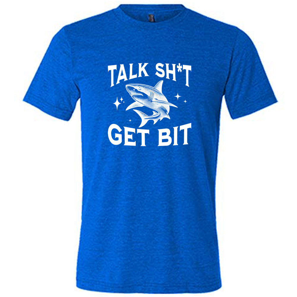 Blue colored shirt with a shark graphic on it that says "Talk Shit Get Bit"