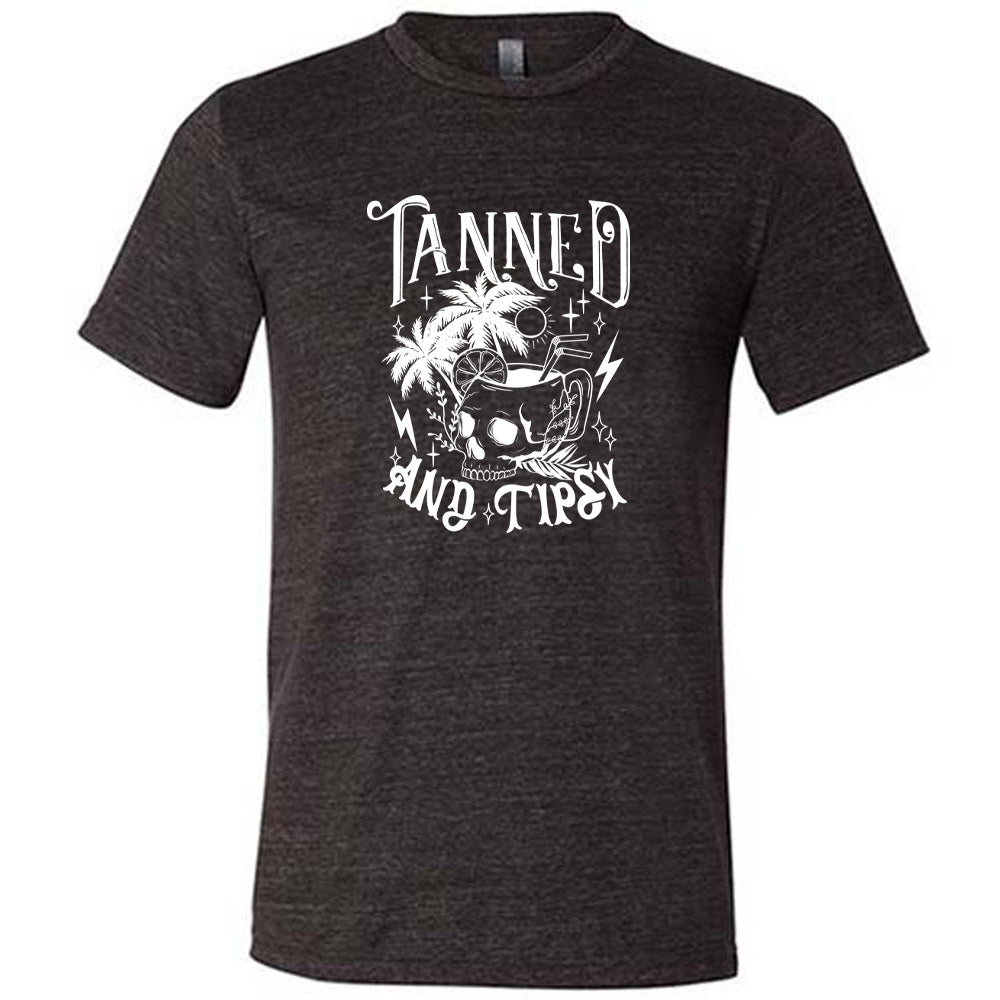 Black colored shirt with a drink inside a skull cup graphic on it that says "Tanned and Tipsy"