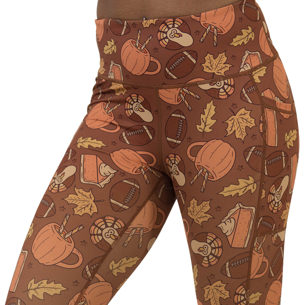 leggings with pumpkins, leaves, and football