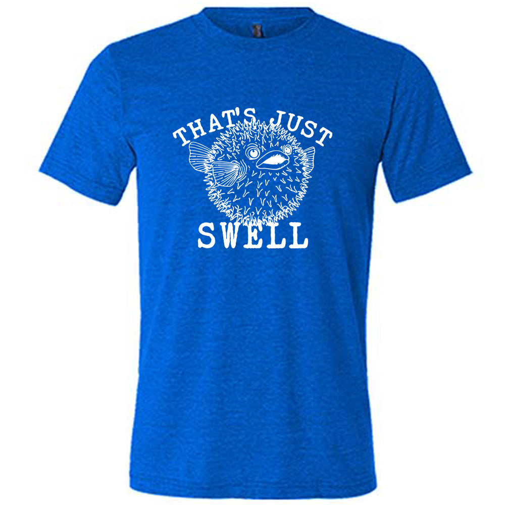 Blue colored shirt with a pufferfish graphic on it that says "That's Just Swell"