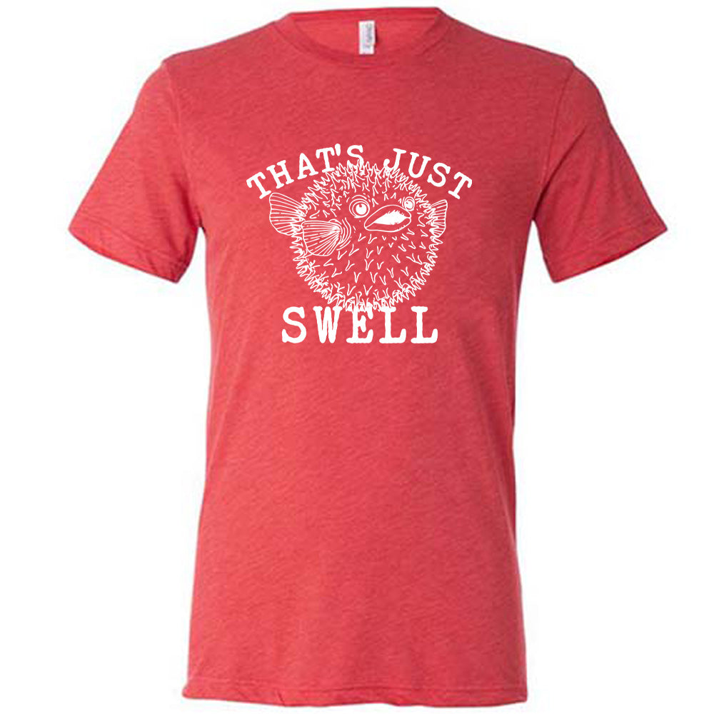 Red colored shirt with a pufferfish graphic on it that says "That's Just Swell"