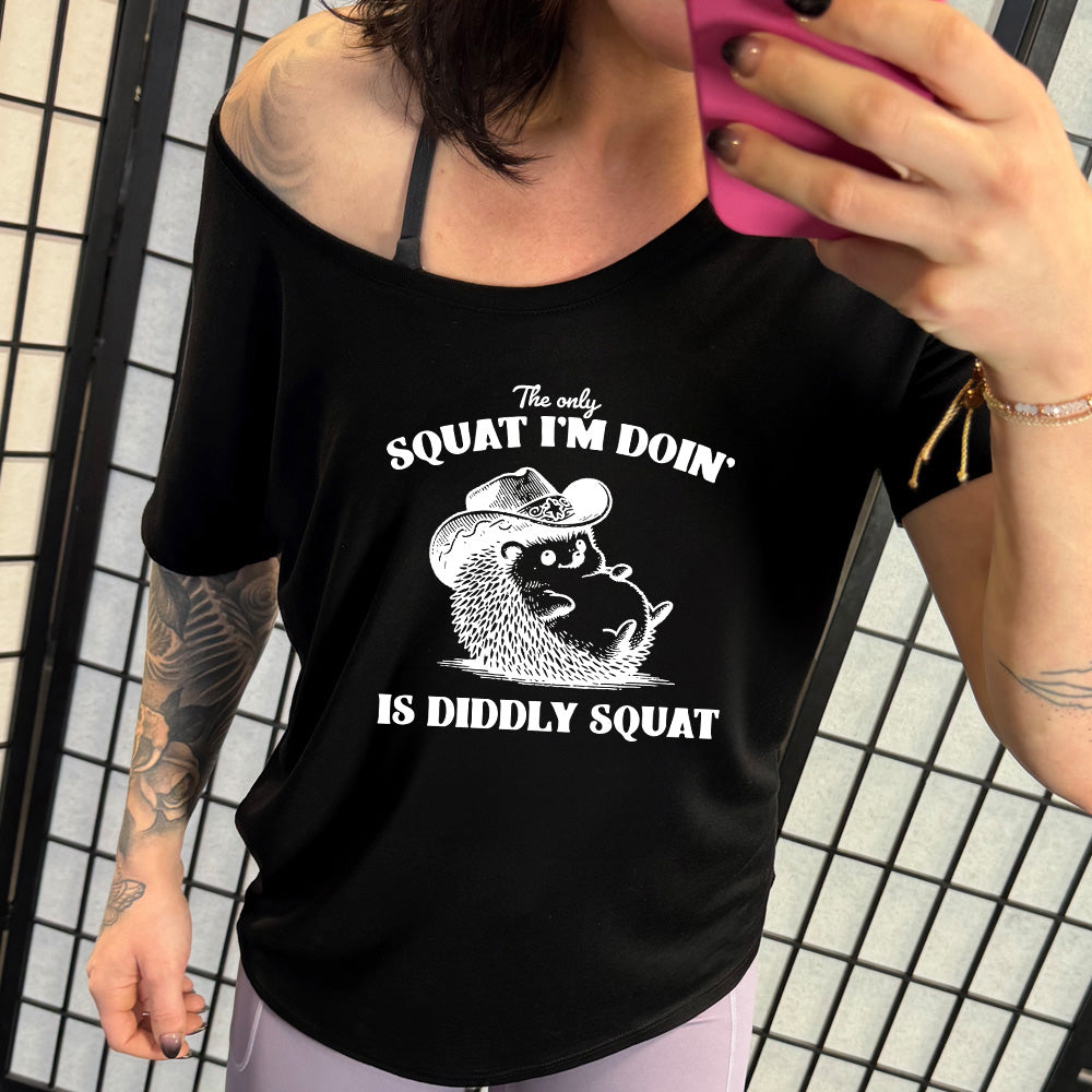 shirt with a porcupine in a cowboy hat graphic on it that says "The Only Squat I'm Doing Is Diddly Squat"