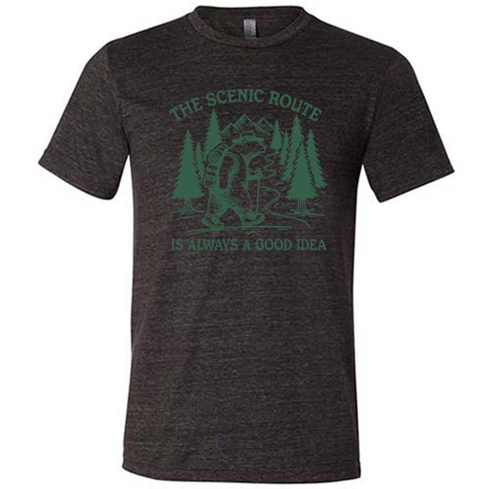 black unisex tee with the words "the scenic route is always a good idea" with a bear hiking on a trail through the woods