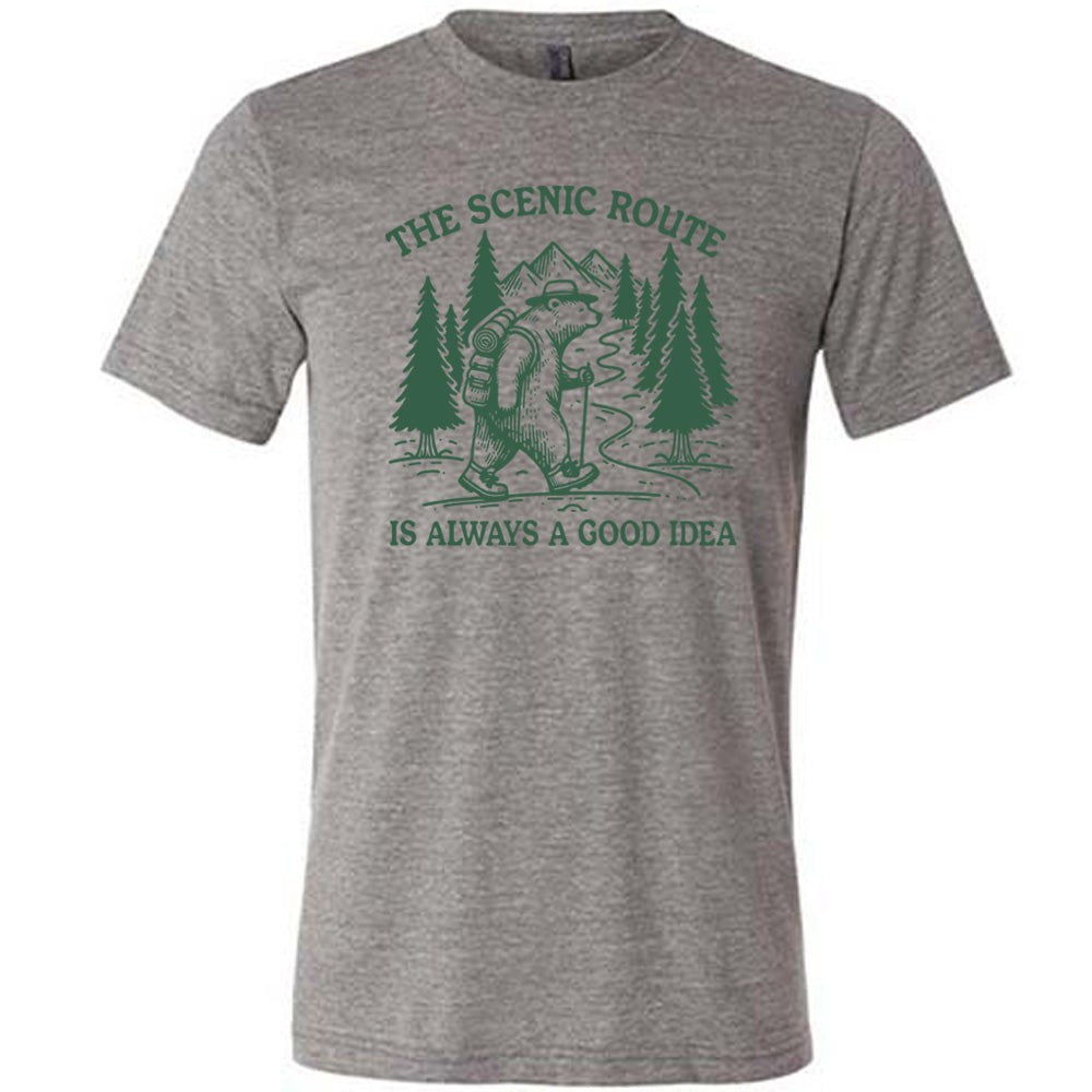 grey unisex tee with the words "the scenic route is always a good idea" with a bear hiking on a trail through the woods