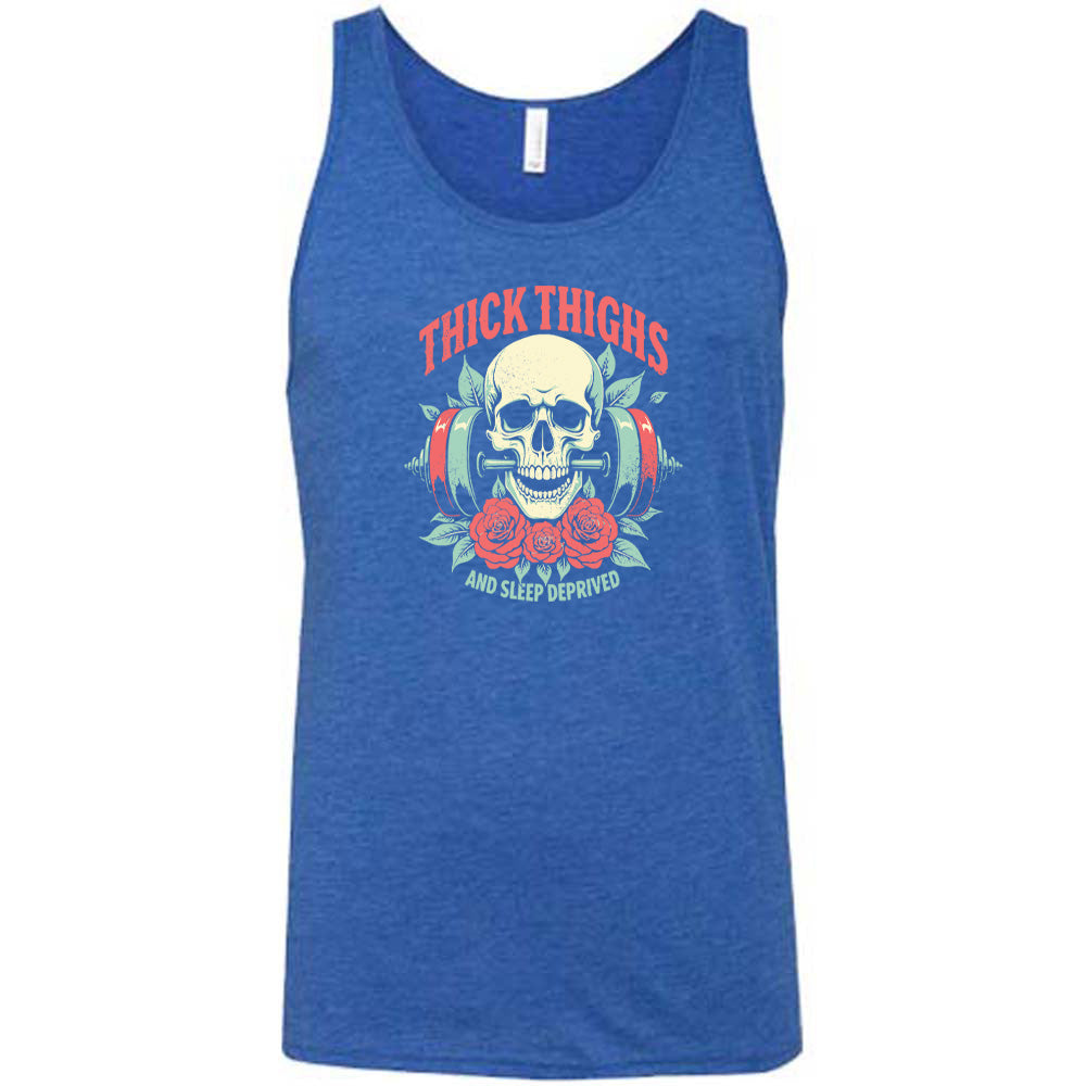 Blue colored tank with a skull, flowers, and barbell graphic on it that says "Thick Thighs And Sleep Deprived"