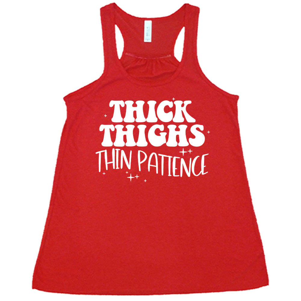 Red Flowy Tank with Thick Thighs Thin Patience in white lettering, with little stars