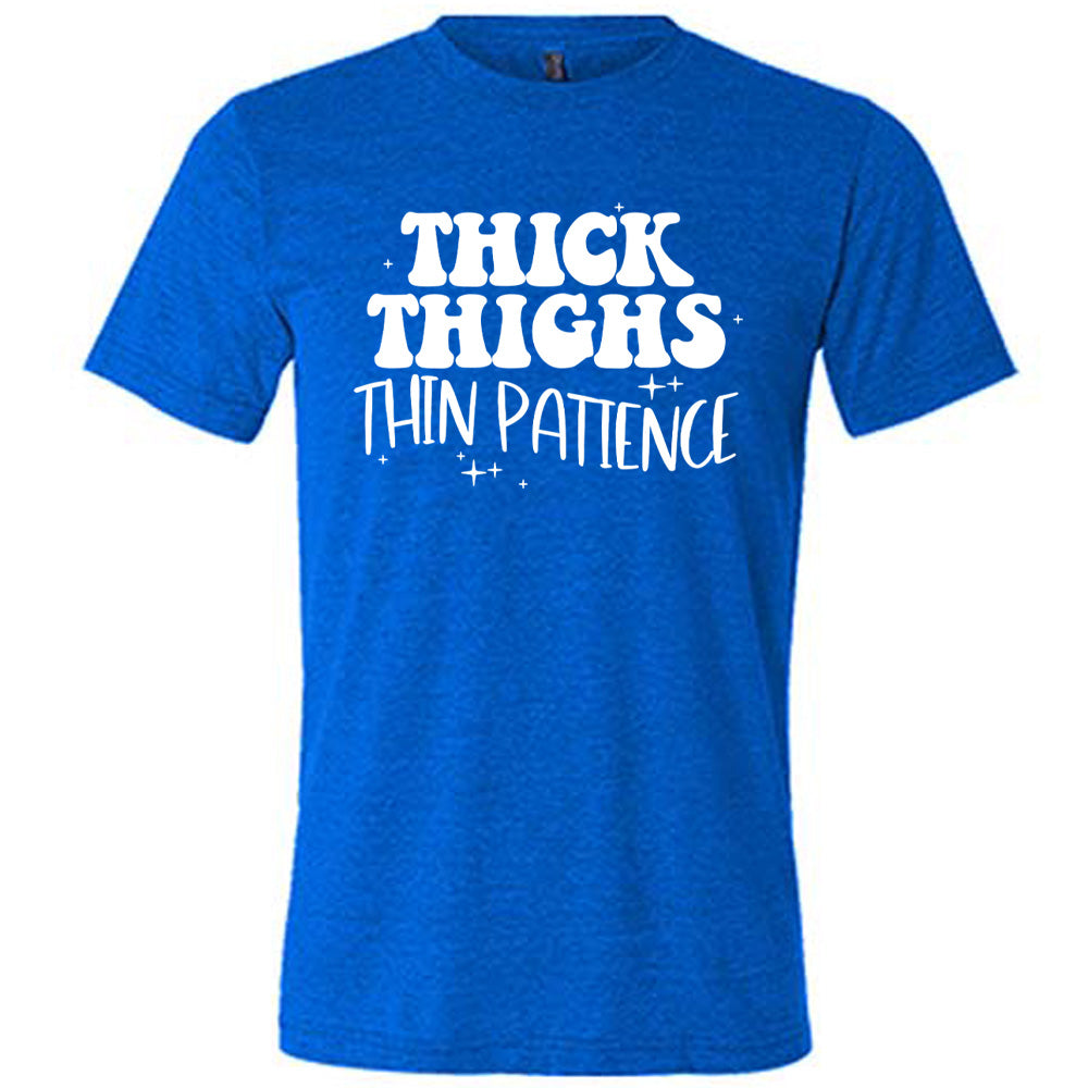 blue unisex tee with the words "thick thighs thin patience" on it, with a few scattered little stars