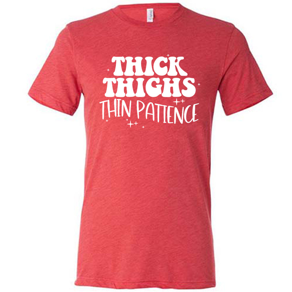 red unisex tee with the words "thick thighs thin patience" on it, with a few scattered little stars