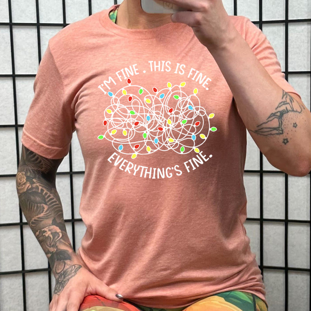 peach shirt with the text "I'm Fine. This Is Fine. Everything's Fine." on it