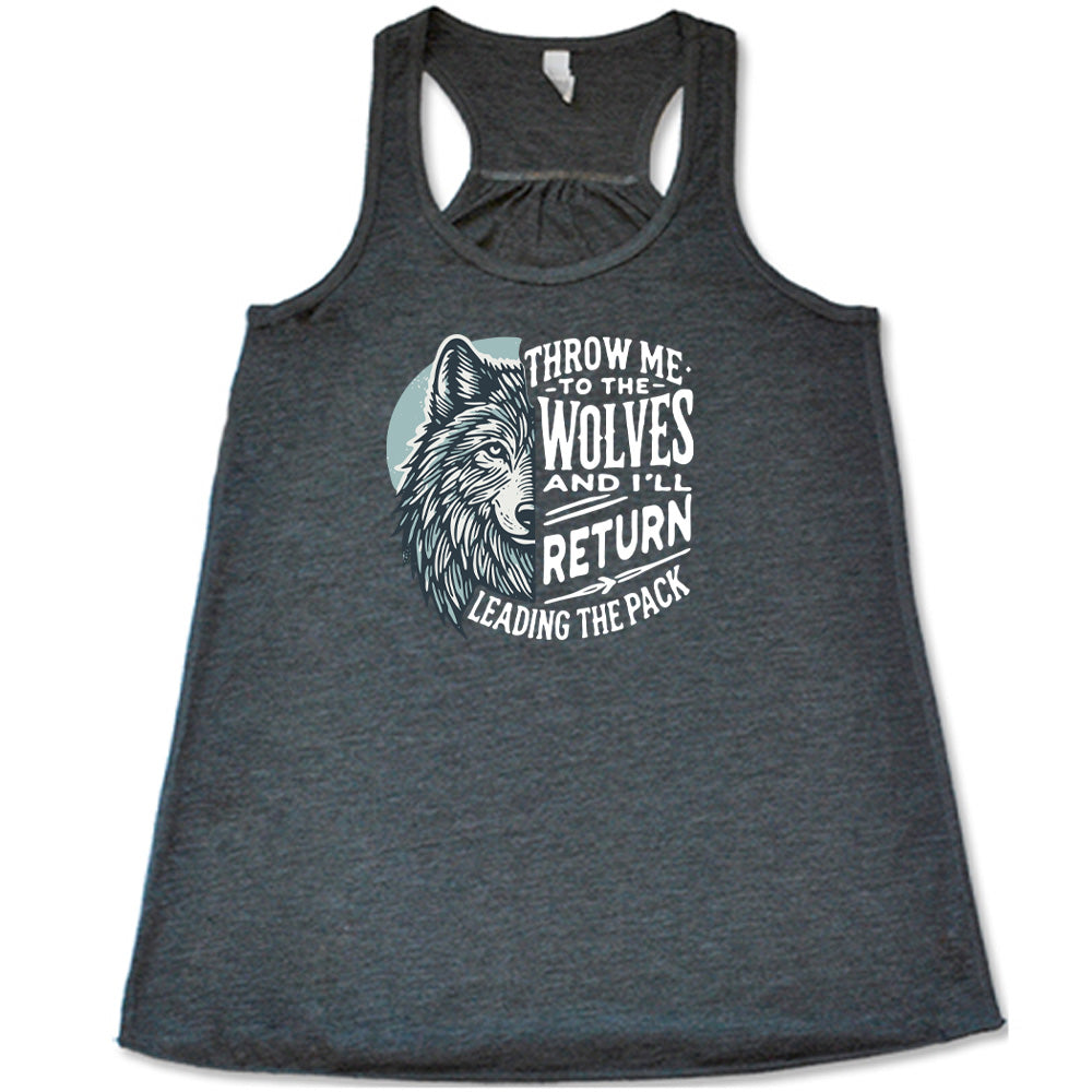 Grey colored flowy tank with a wolf face graphic on it that says "Throw Me To The Wolves And I'll Return Leading the Pack"