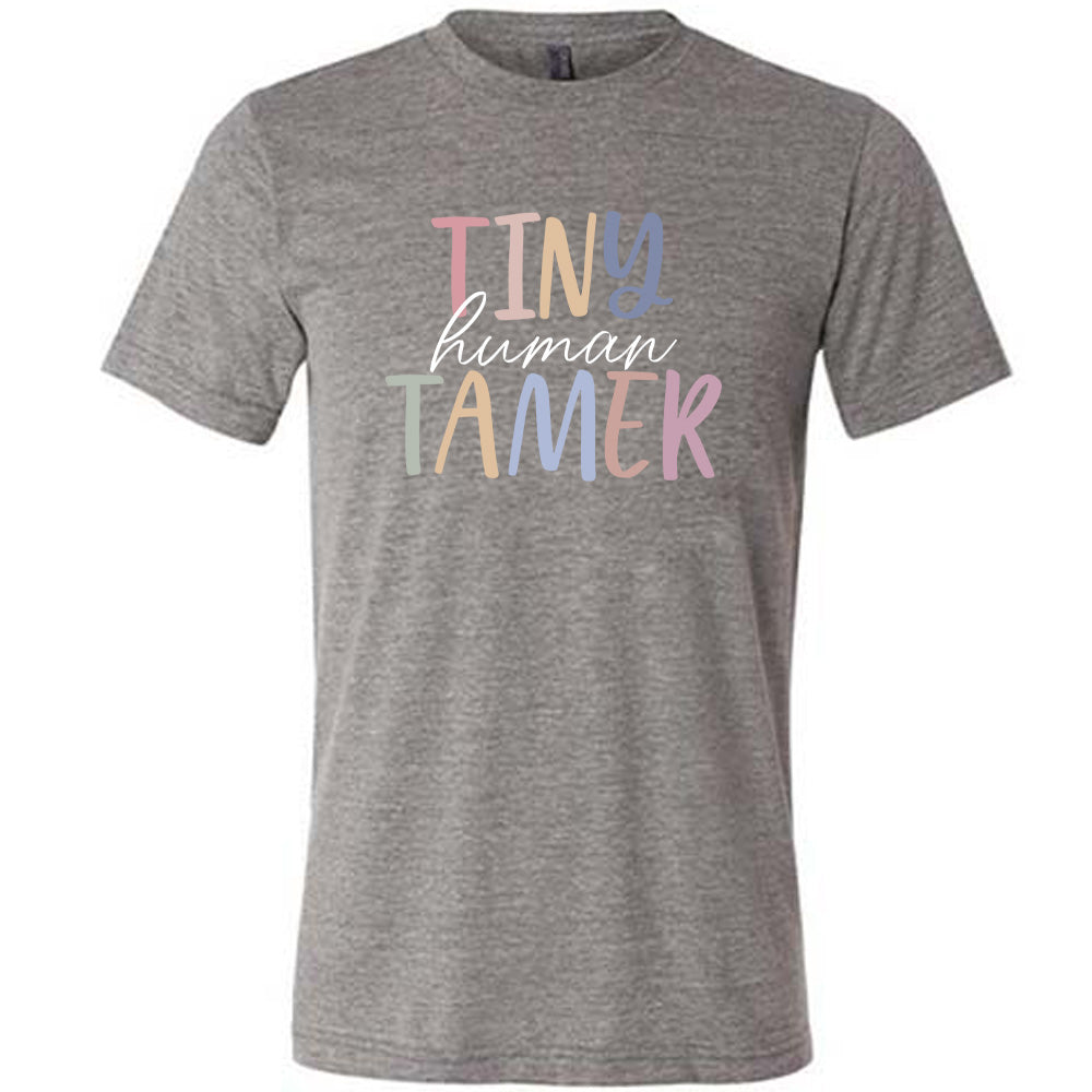 Grey colored shirt with a graphic on it that says "Tiny Human Tamer"