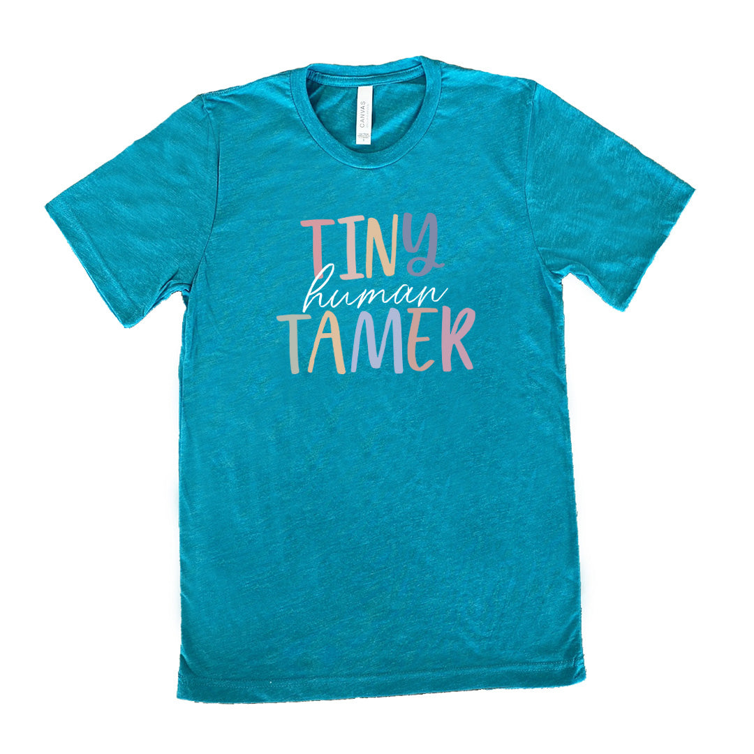 Teal colored shirt with a graphic on it that says "Tiny Human Tamer"