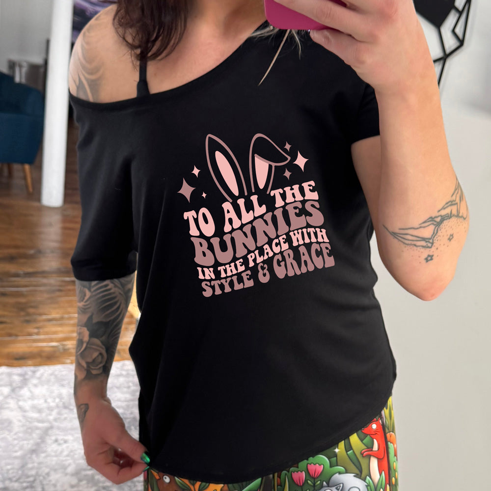 Black colored shirt with a bunny ear graphic on it that says "To All The Bunnies in the Place with Style and Grace"
