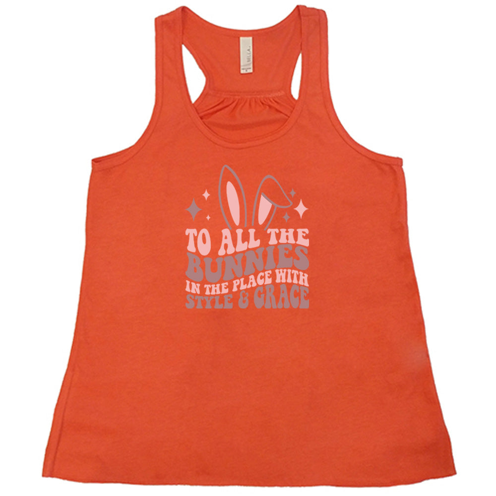Coral colored flowy tank with a bunny ear graphic on it that says "To All The Bunnies in the Place with Style and Grace"