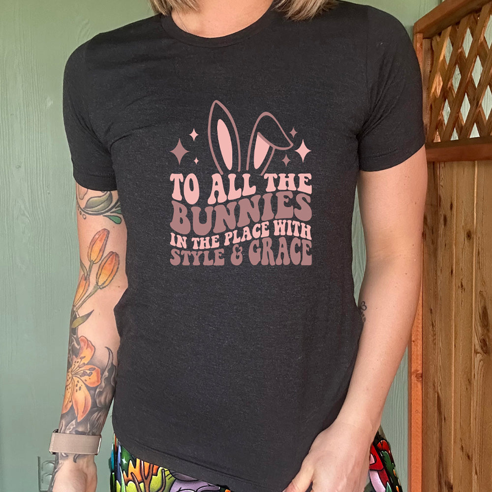 Black colored shirt with a bunny ear graphic on it that says "To All The Bunnies in the Place with Style and Grace"