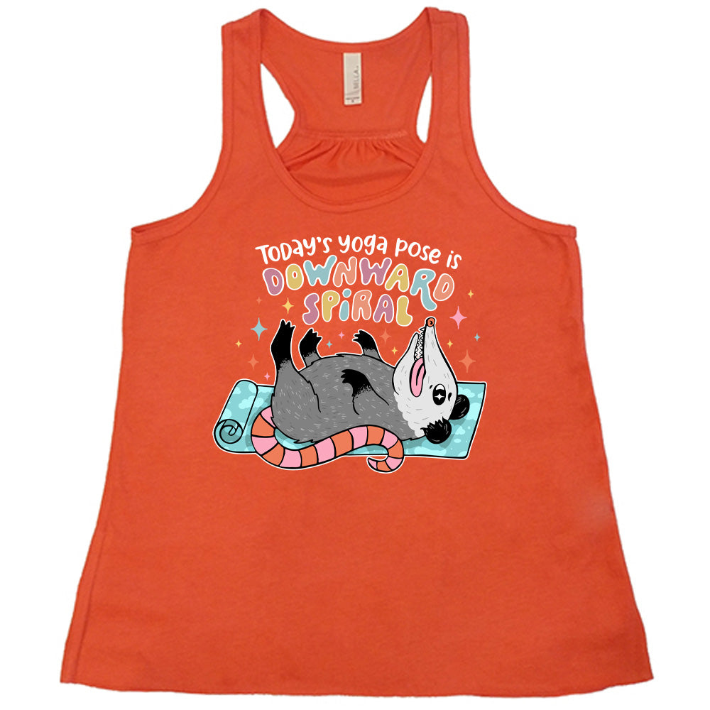 Coral flowy tank with the words "Today's yoga pose is a downward spiral" and the graphic of a possum playing dead on a yoga mat