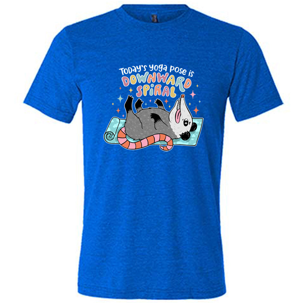 Blue unisex tee with the words "Today's yoga pose is a downward spiral" and the graphic of a possum playing dead on a yoga mat