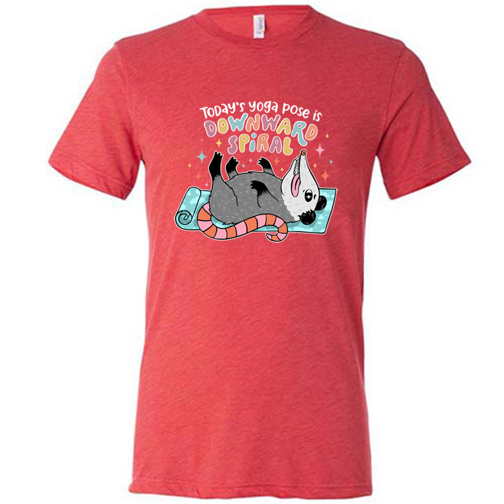 Red unisex tee with the words "Today's yoga pose is a downward spiral" and the graphic of a possum playing dead on a yoga mat