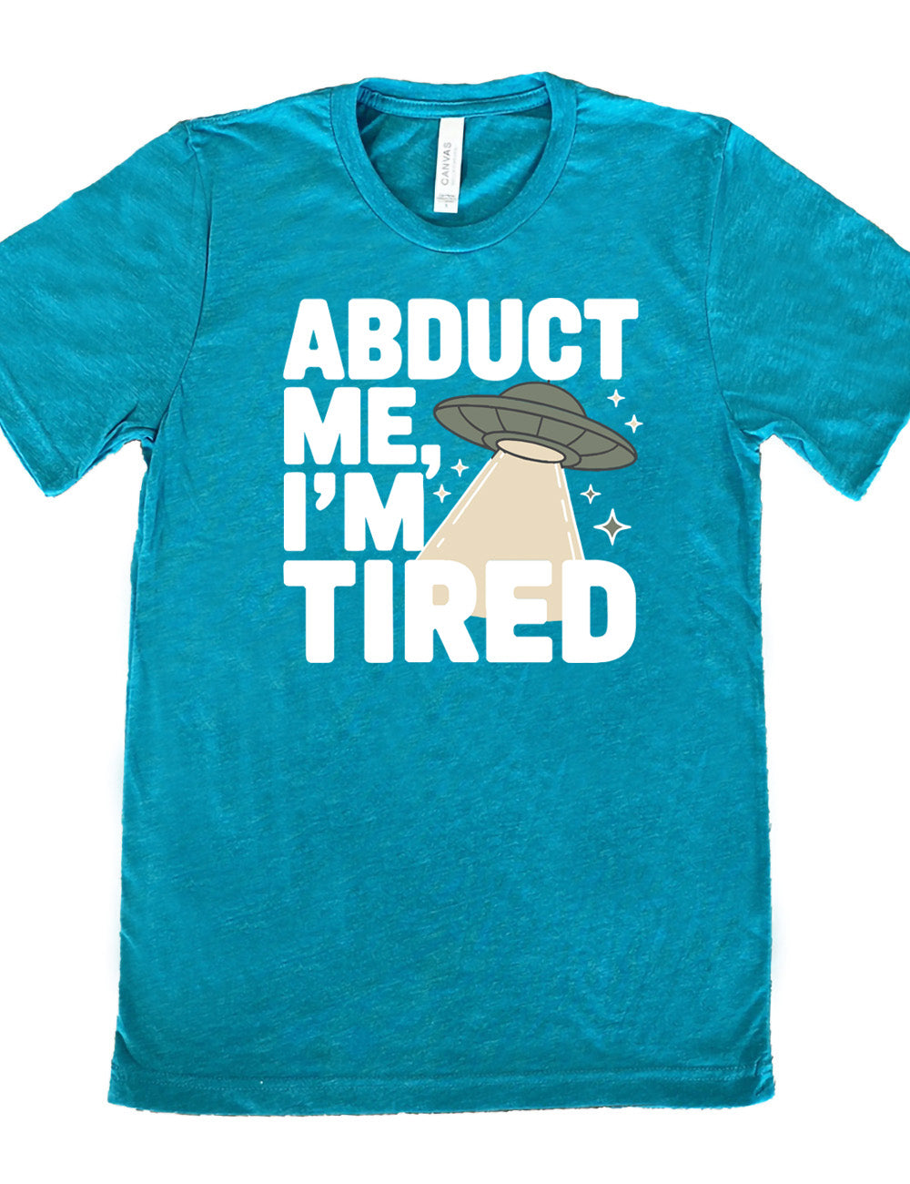 teal unisex tee with the words "abduct me, I'm tired" on it, with a graphic of an alien spaceship, with a beam extended, and a few little stars