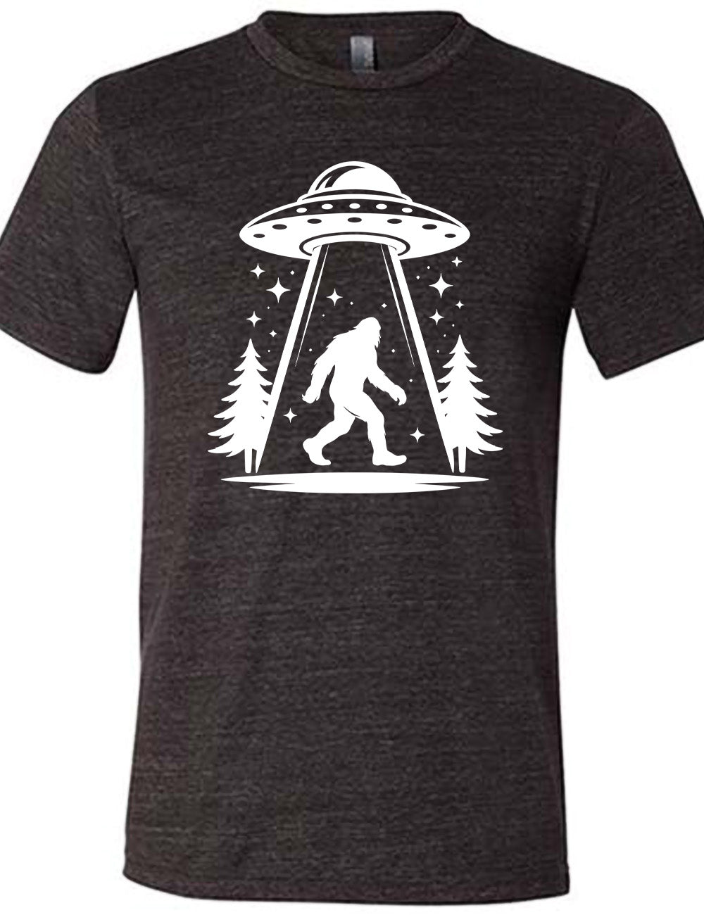 black unisex tee with the graphic of an alien spaceship beaming bigfoot up, with stars surrounding, and couple pine trees