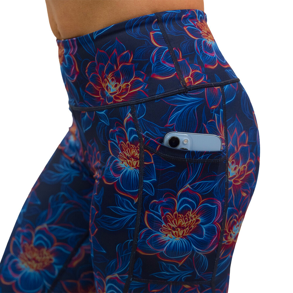 close up of luminous lotus leggings with a phone in the pocket