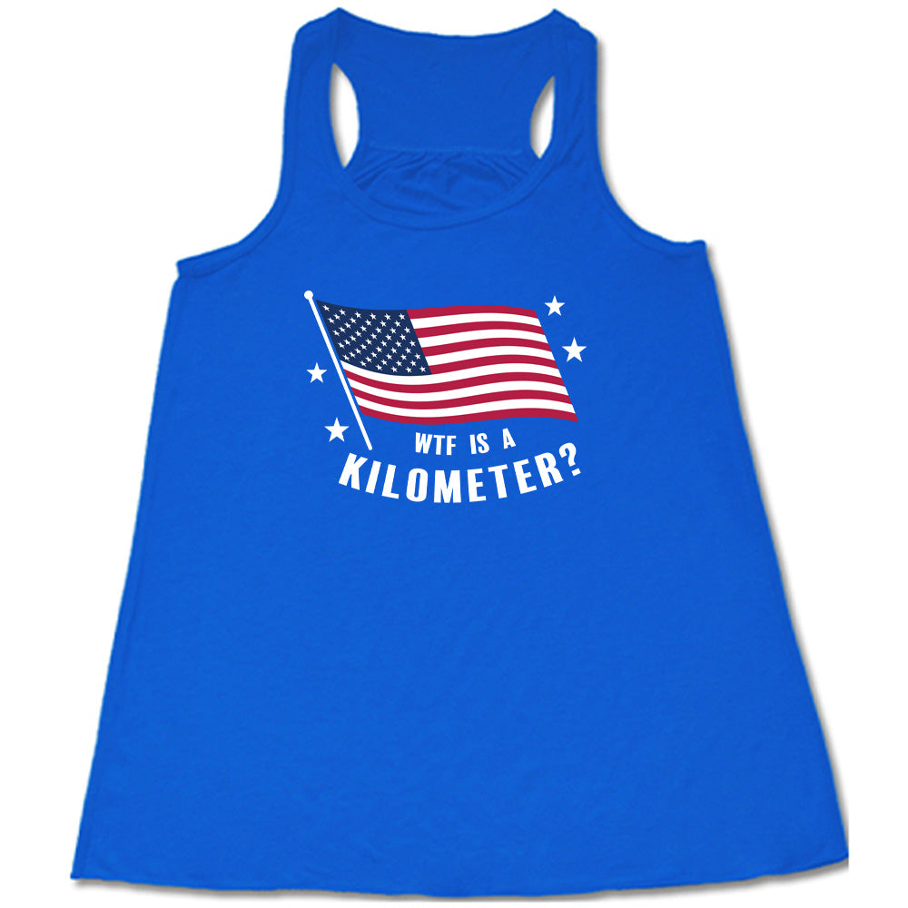 Blue colored flowy tank with an American flag graphic on it that says "WTF Is A Kilometer?"