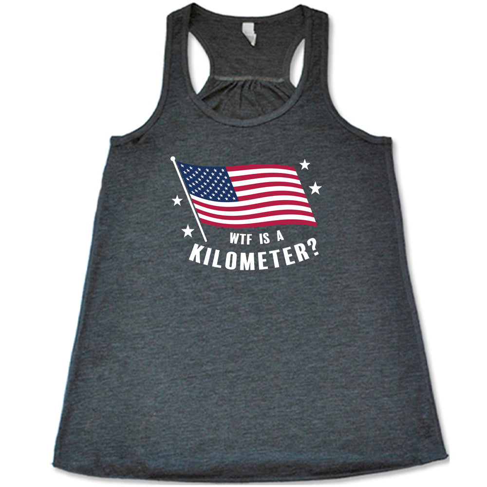 Grey colored flowy tank with an American flag graphic on it that says "WTF Is A Kilometer?"