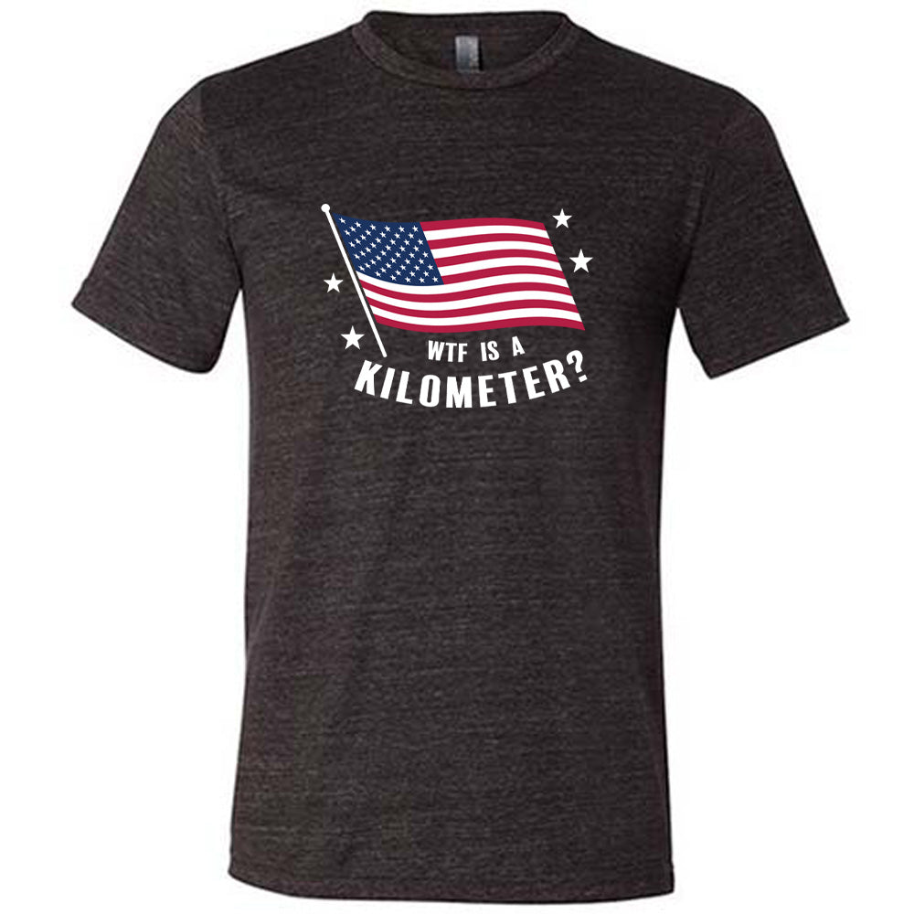 Black colored shirt with an American flag graphic on it that says "WTF Is A Kilometer?"