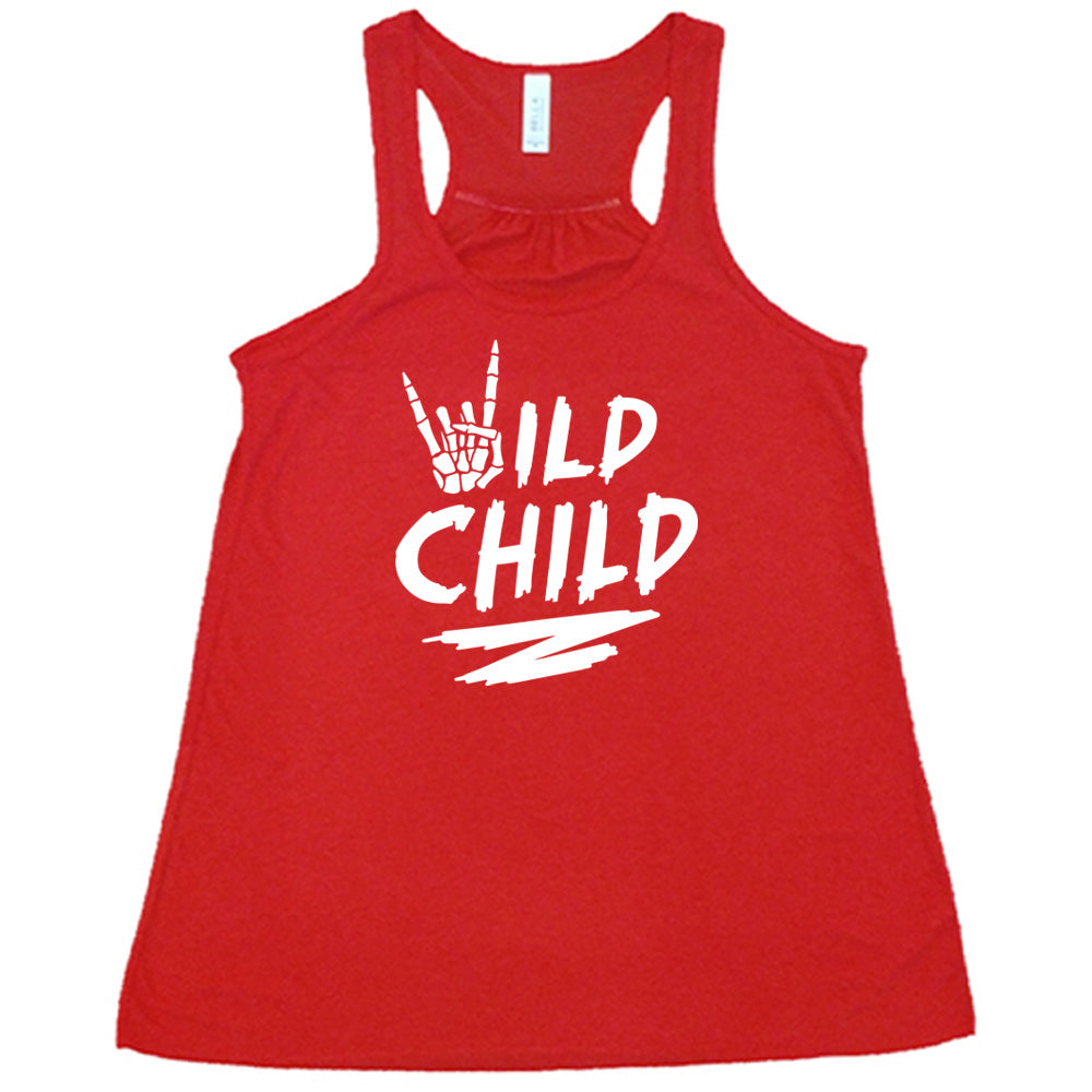 Red colored flowy tank with a skeleton hand signing rock on graphic on it that says "Wild Child"