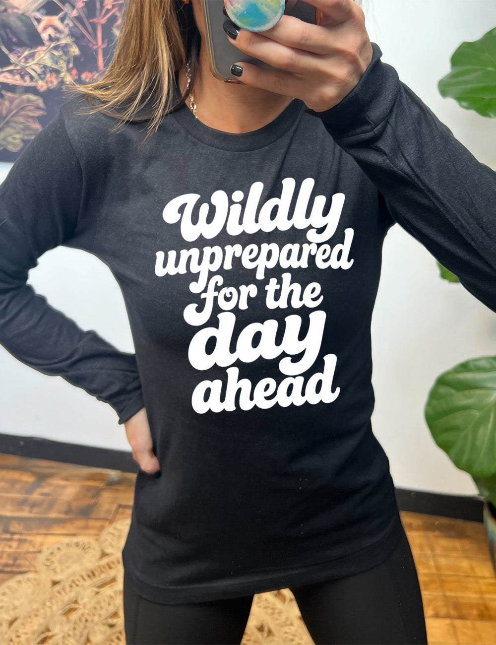 heather black long sleeve tee with words on it saying "Wildly unprepared for the day ahead"