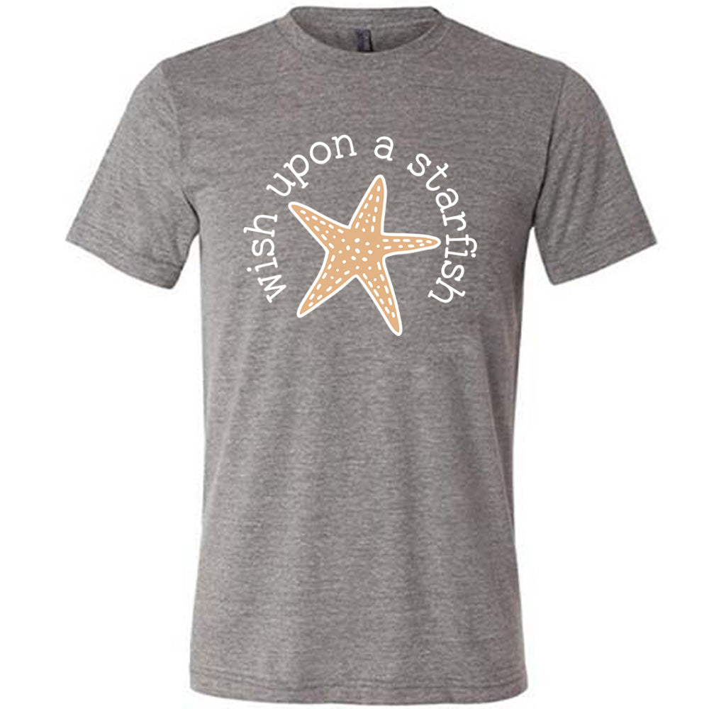 grey unisex tee with the graphic of a starfish, and the words arched around it saying "wish upon a starfish"