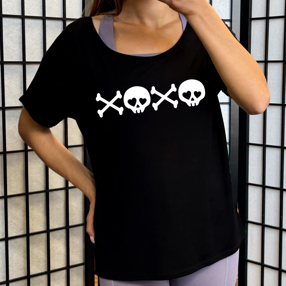 black slouchy shirt with xoxo skulls graphic on it