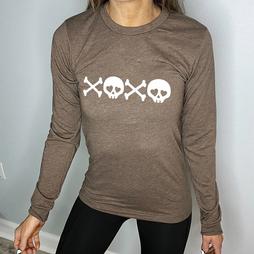 heather brown long sleeve shirt with graphics of crossed-bones and skulls (with hearts for eyes) forming the phrase "XOXO"