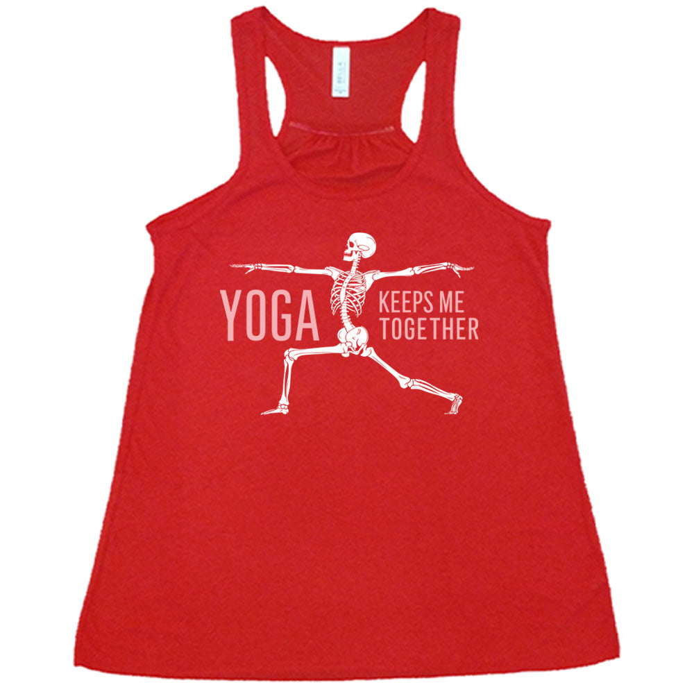 red flowy tank with the words "yoga keeps me together" with graphic of a skeleton doing the warrior pose