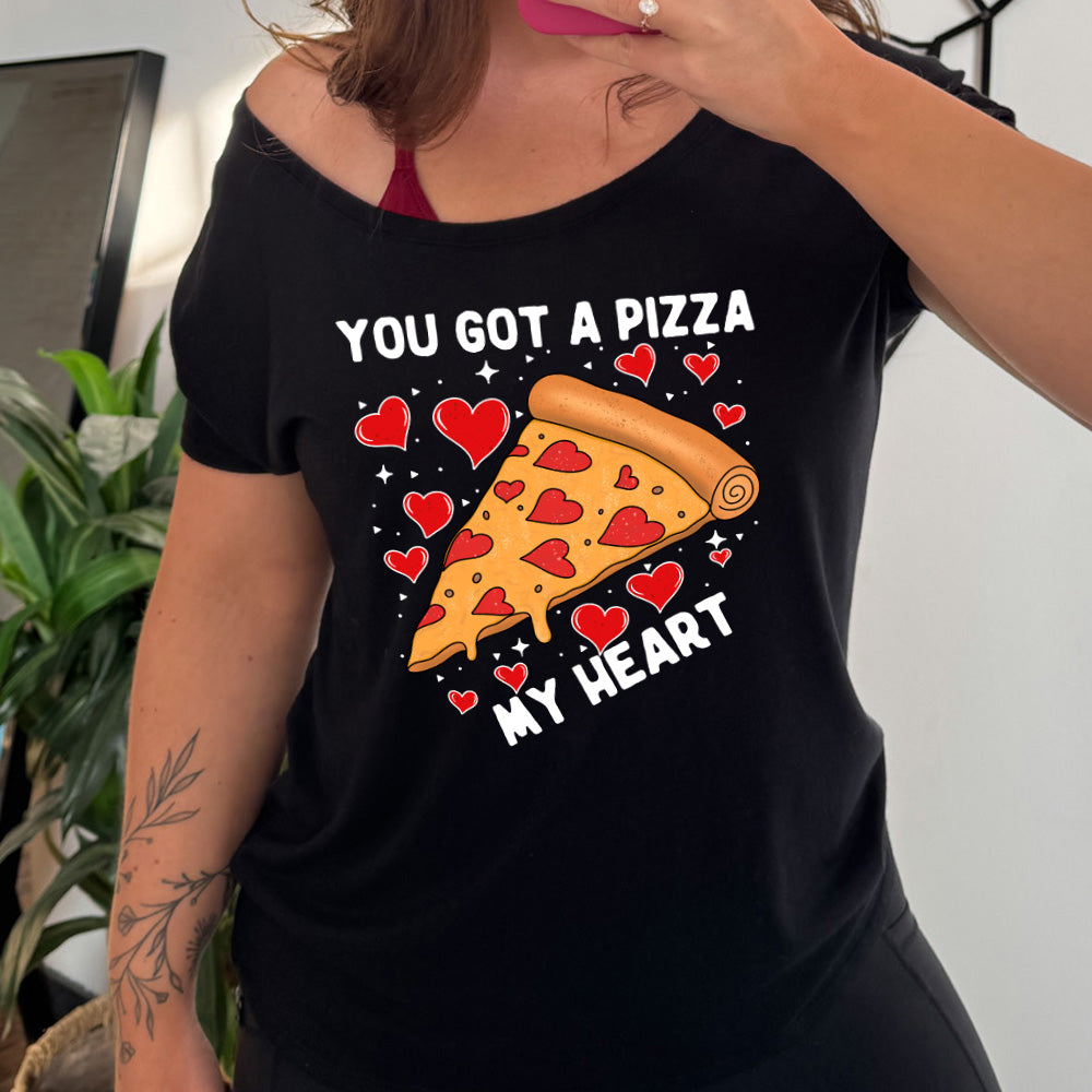 black slouchy shirt with the words "you got a pizza my heart" on it, with a big graphic of a pizza with pepperoni hearts, and hearts surrounding it as well with little stars