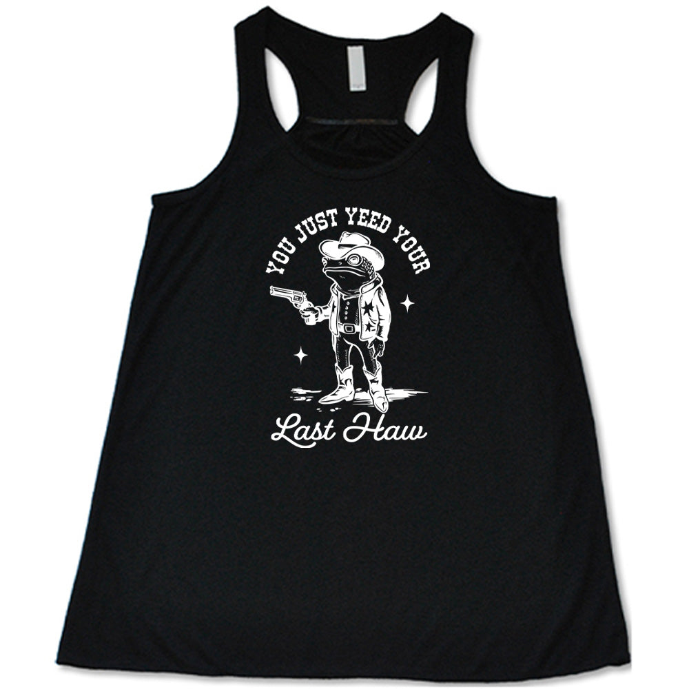 Black colored flowy tank with a cowboy frog graphic on it that says "You Just Yee'd Your Last Haw"