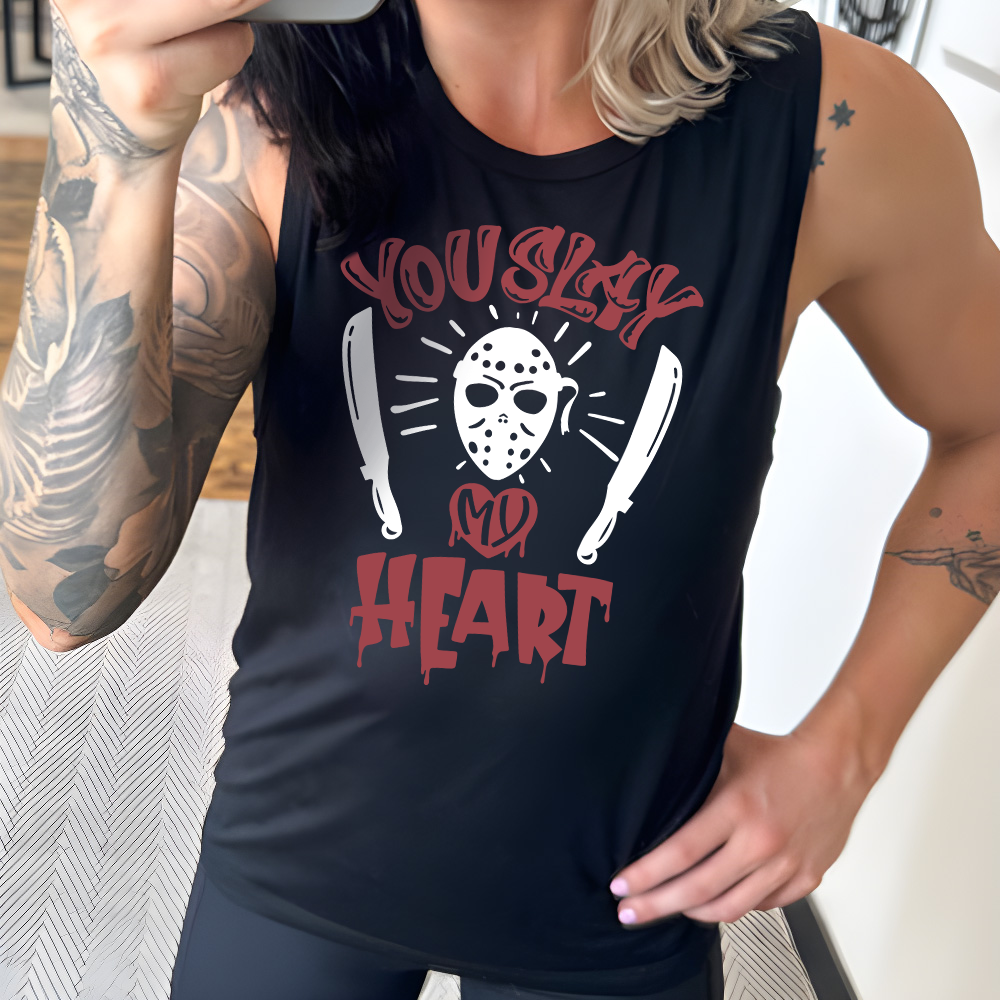 black muscle tank with the words "you slay my heart" on it in horror movie style writing, with "my' being in a dripping heart, and graphics of the Jason mask from Friday the 13th and two machetes