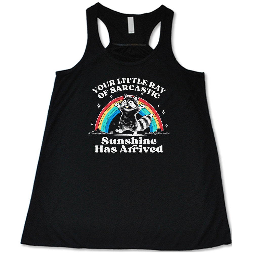 Black colored flowy tank with a rainbow and raccoon graphic on it that says "Your Little Ray of Sarcastic Sunshine Has Arrived"