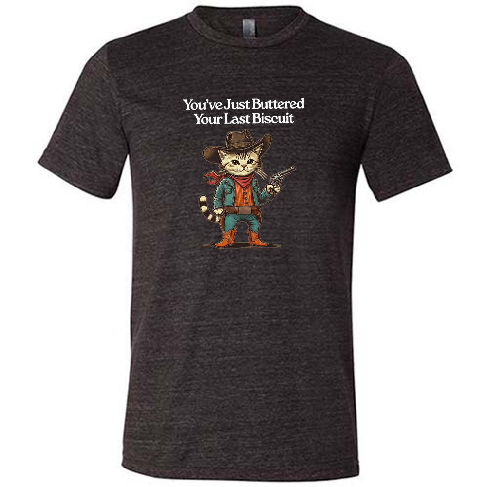 Black colored shirt with a cowboy cat graphic on it that says "You've Just Buttered Your Last Biscuit"