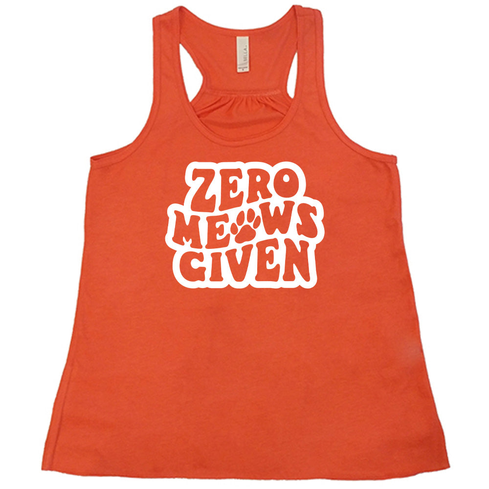 Coral colored flowy tank with paw print graphic on it that says "Zero Meows Given"